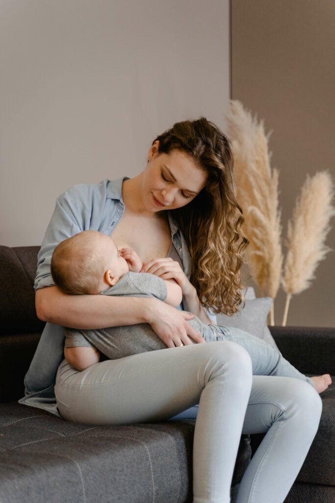 Adorable mom and baby attached with breastfeeding
