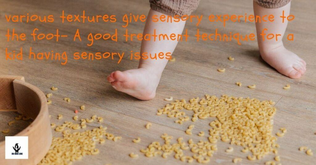 child's foot is walking on seeds and having sensory experiance