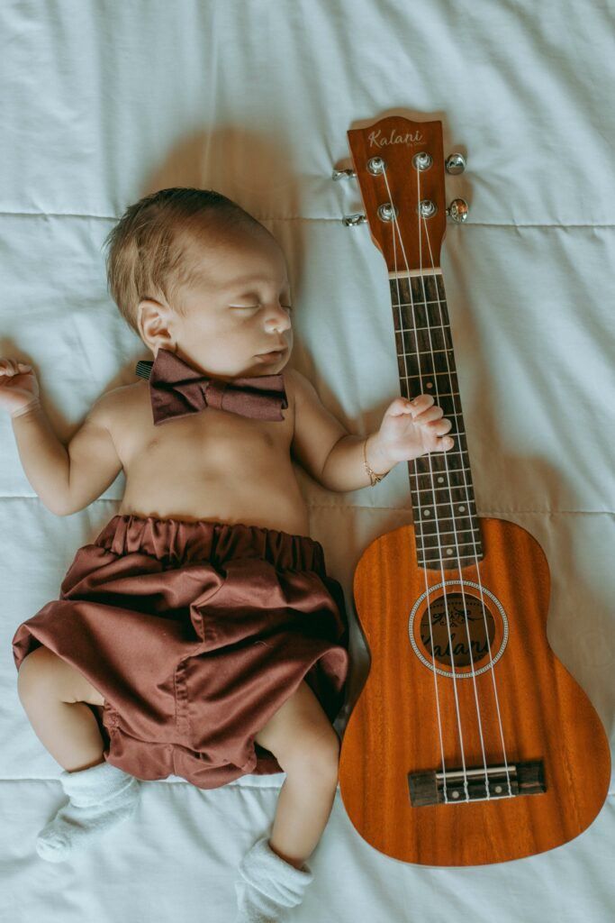 beautiful infant sleepswith a guitar
