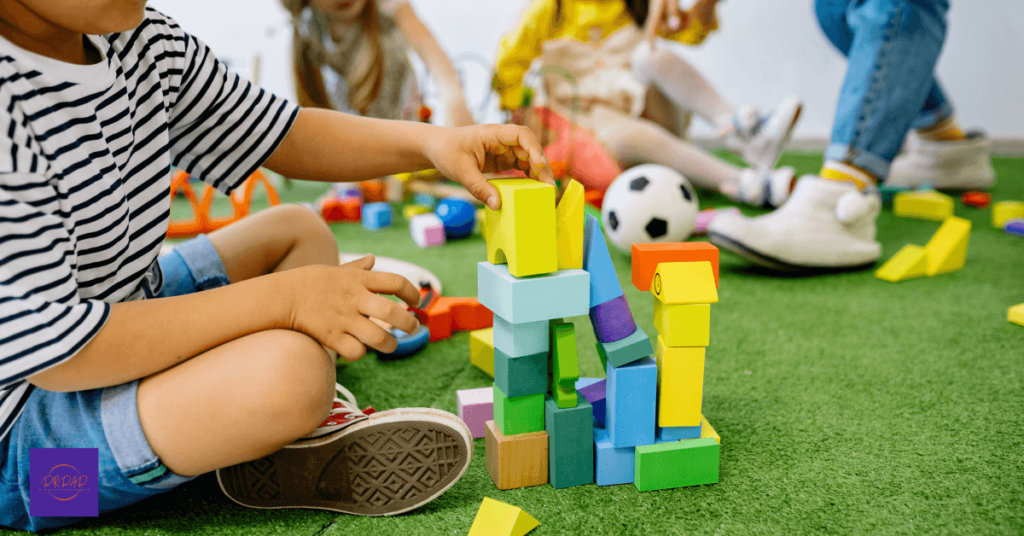 childrenb developmental play activities with building blocks
