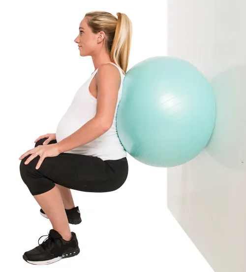pregnant mom exercise with a birthball